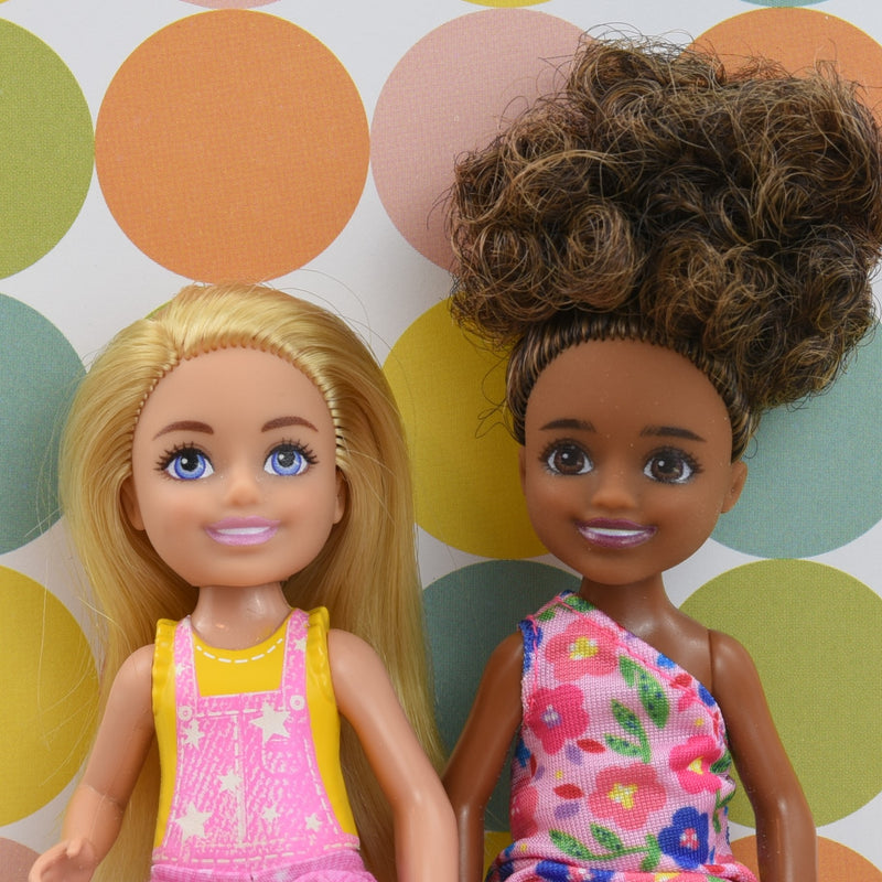 Headshot of two child Barbie dolls named Chelsea and Tiana